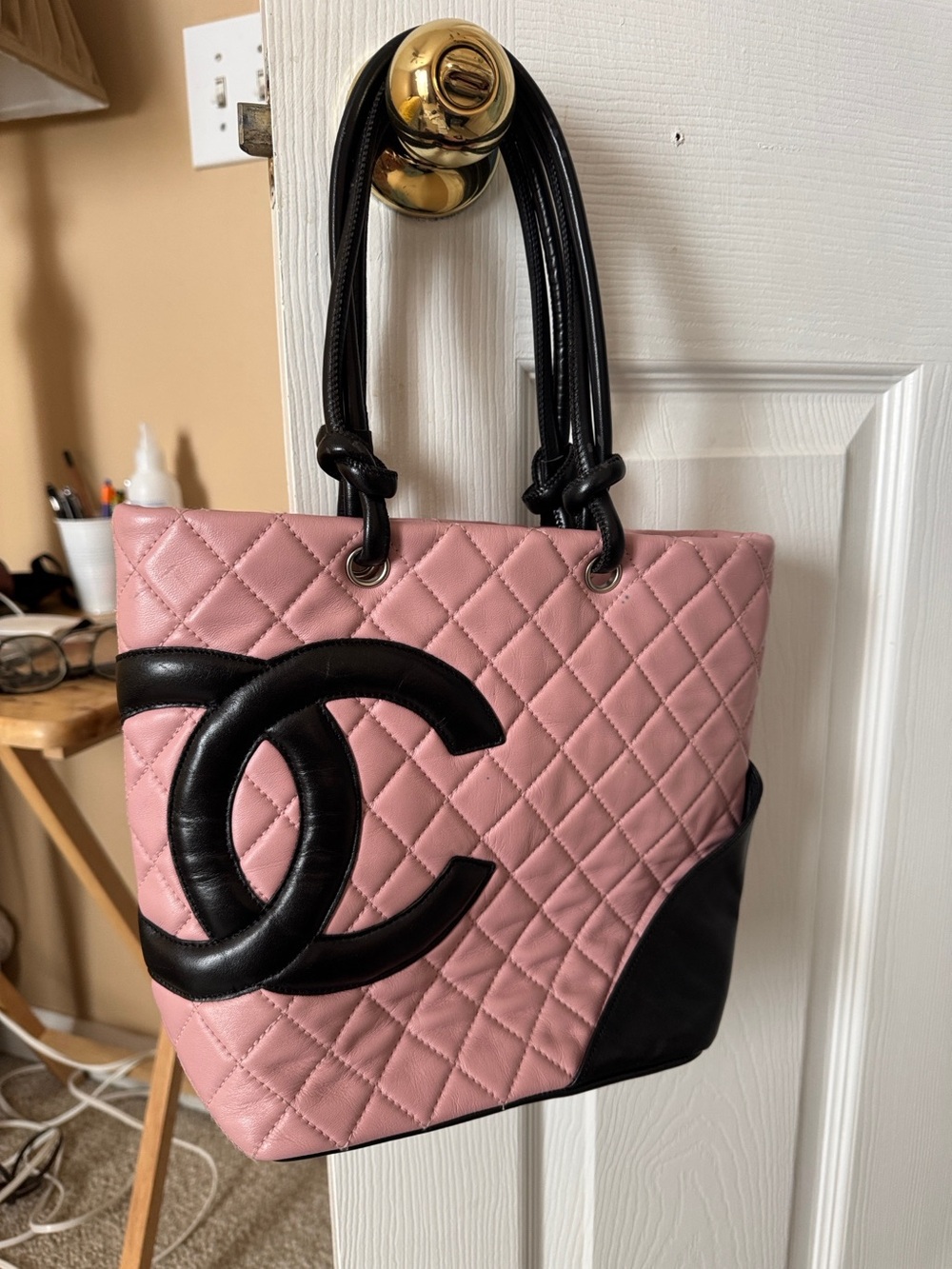 Chanel Cambon Ligne bag 
CHANEL Pink Quilted Leather Tote with Black Trim